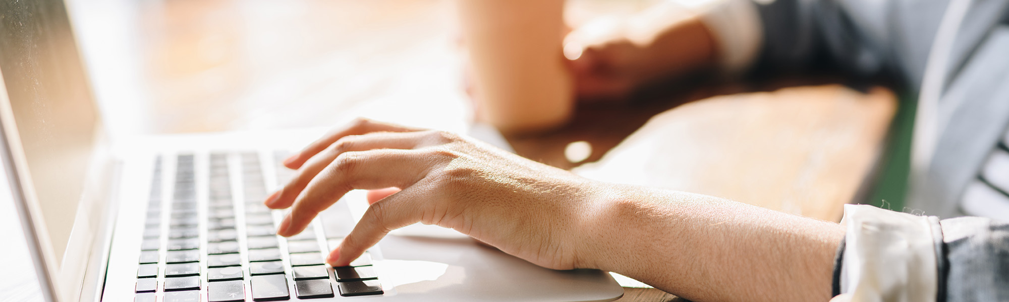 Woman typing on a laptop