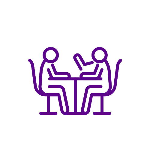 Pictogram of two people siting at a table
