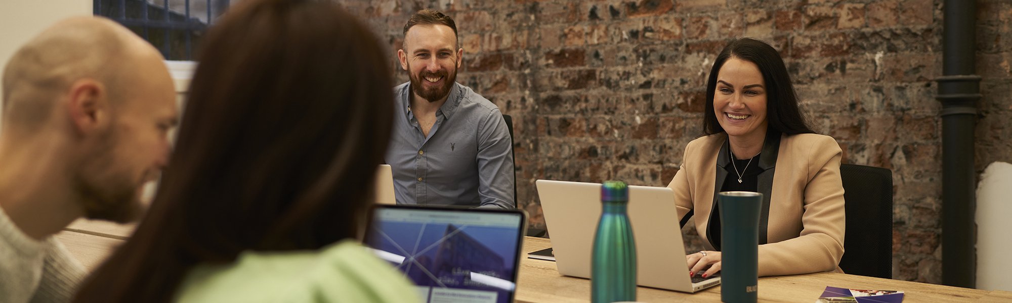 People working around a table in an office