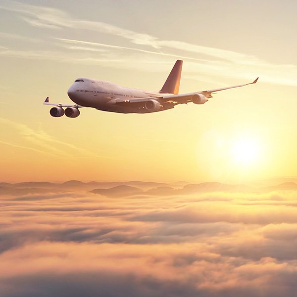 Airplane flying over the clouds 