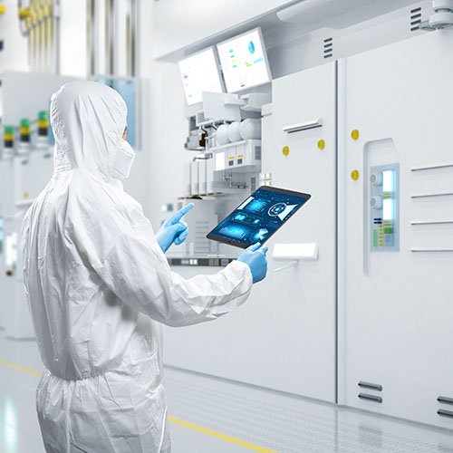 Worker wearing protective suit while work in semiconductor manufacturing factory