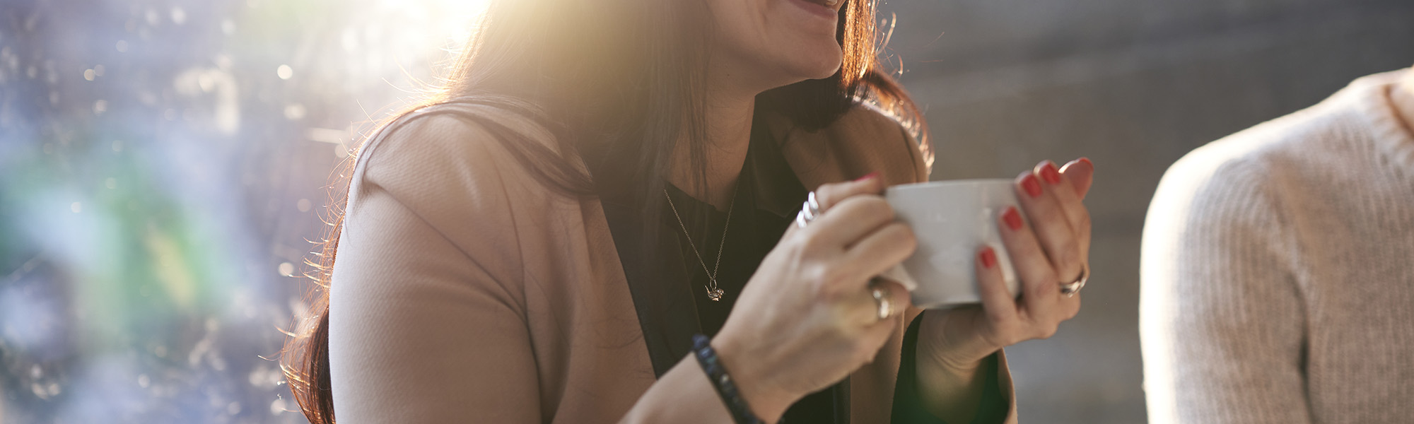 Woman drinking a coffee in iCafe