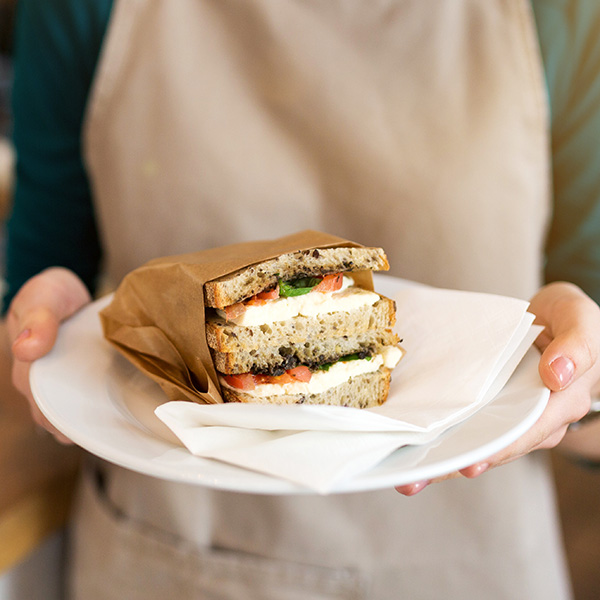 Waitress serving a sandwich