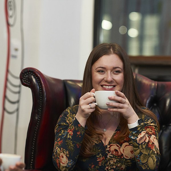 Woman drinking a coffee in Tinderbox