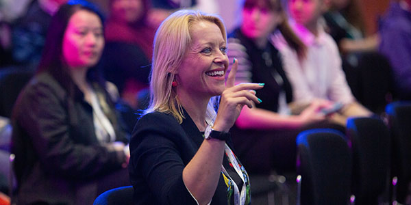 Woman asking a question