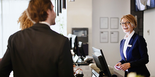 Couple checking into a hotel