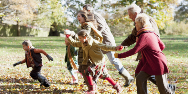 Family playing in field