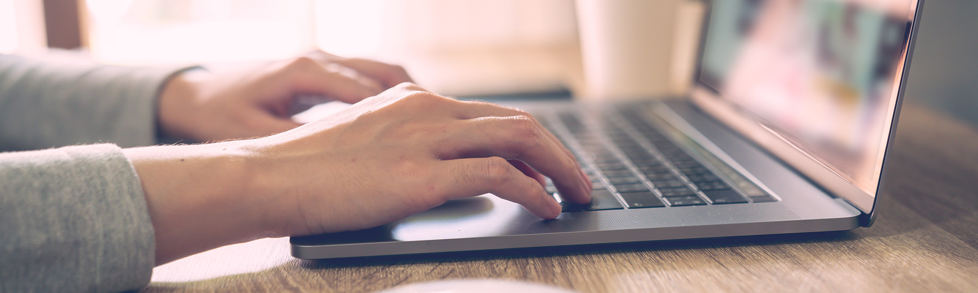 Person typing on a laptop