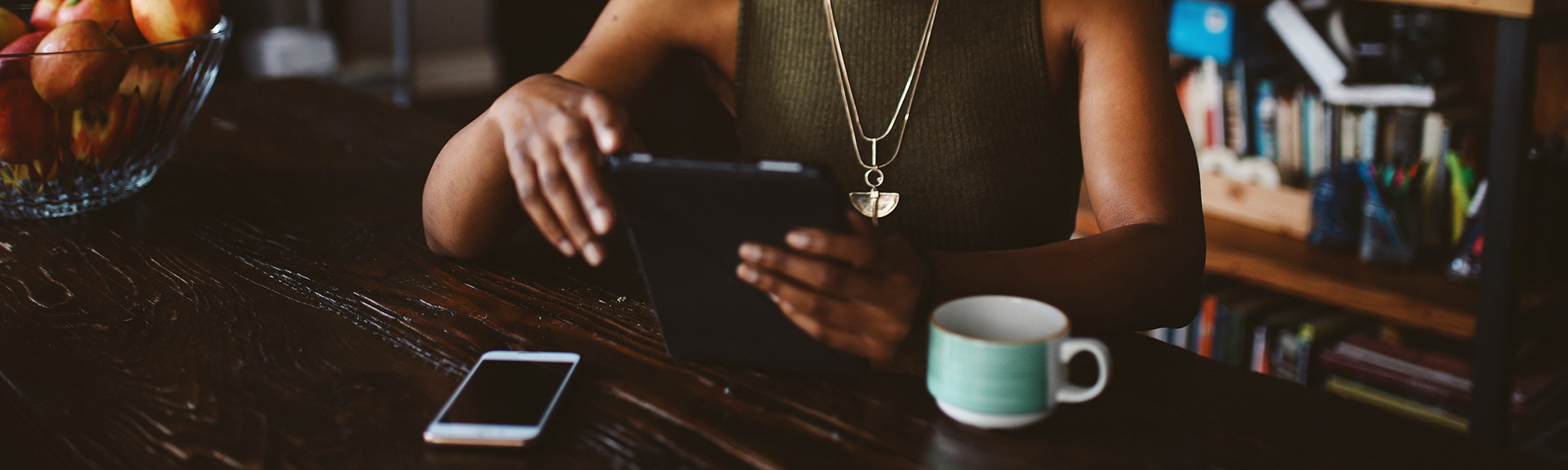 Woman reading a news article on a tablet