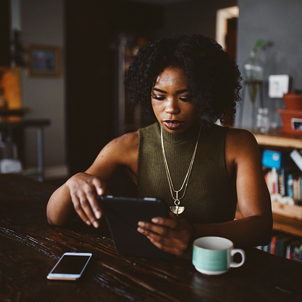 Woman reading the news on her tablet